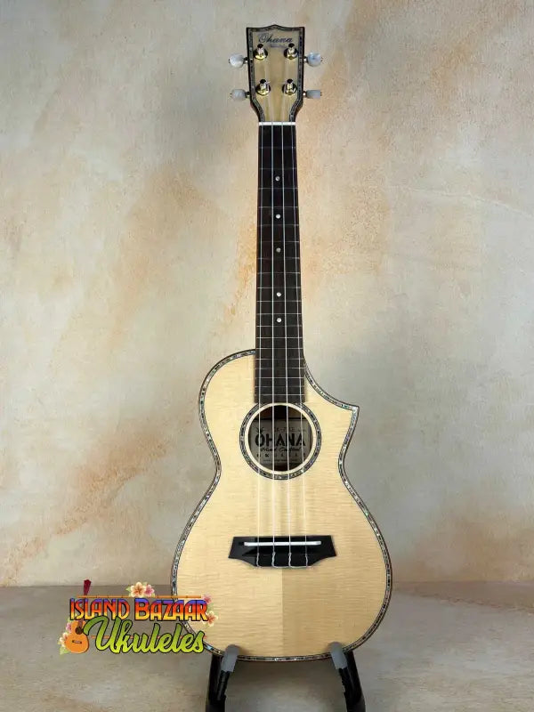 Natural wood Ohana CK-75CG Concert Ukulele with decorative binding and cutaway design