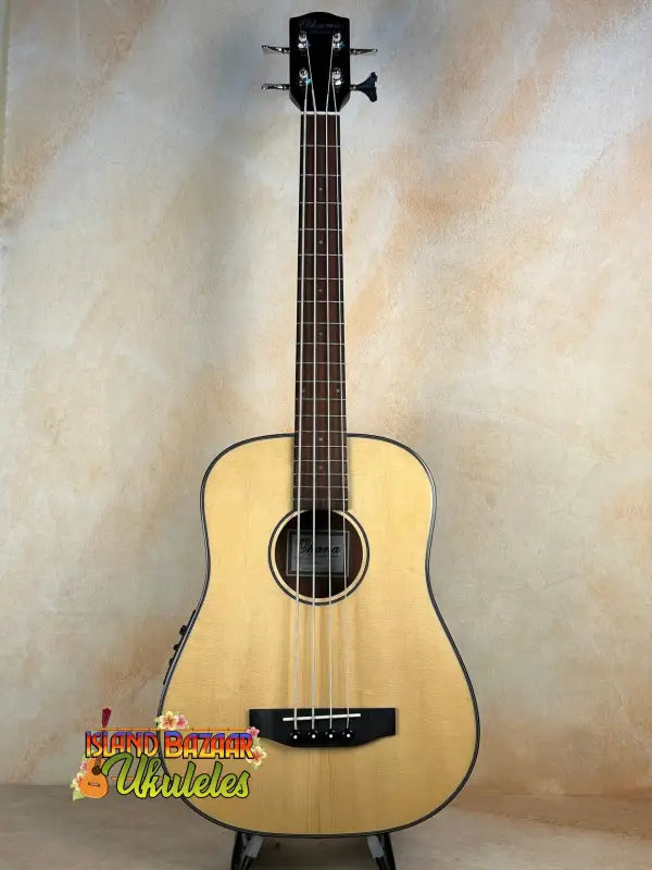 Natural wood Ohana OBU-22 U-Bass with four strings and pickup for rhythm line ukulele