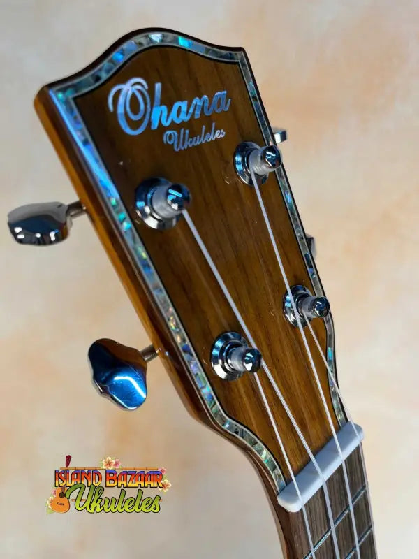 Ohana PKC-50G Solid Cedar with brown wooden headstock and chrome tuning pegs