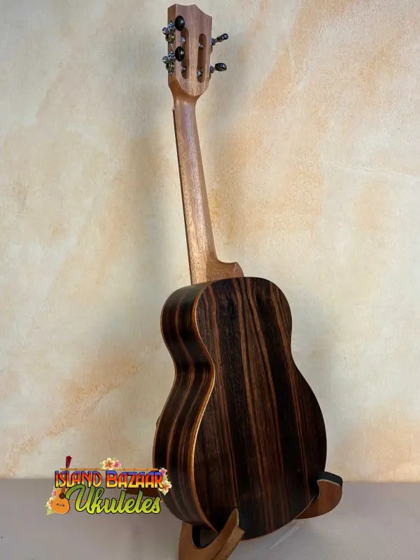 Ohana TK-50ME Solid Cedar Top Tenor Ukulele with dark wood grain patterns