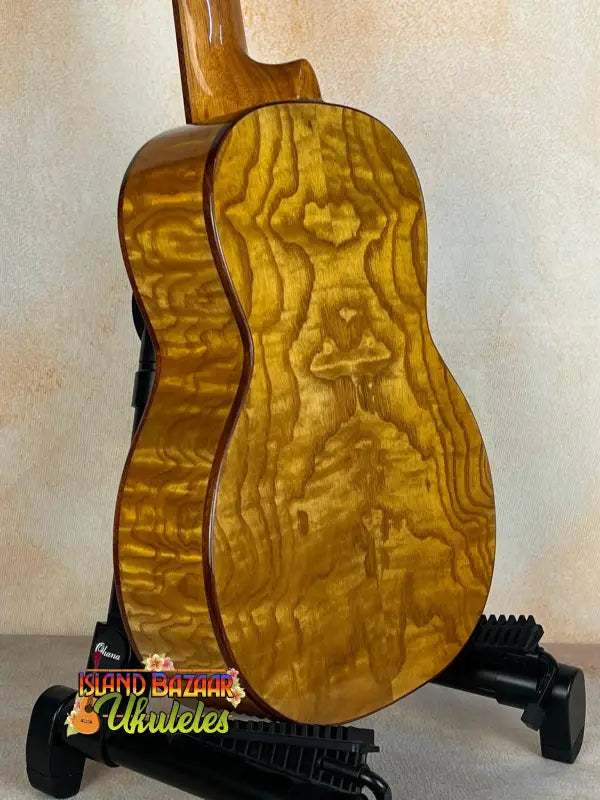 Acoustic guitar featuring quilted maple wood grain on the Ohana TK-50WG Tenor Ukulele