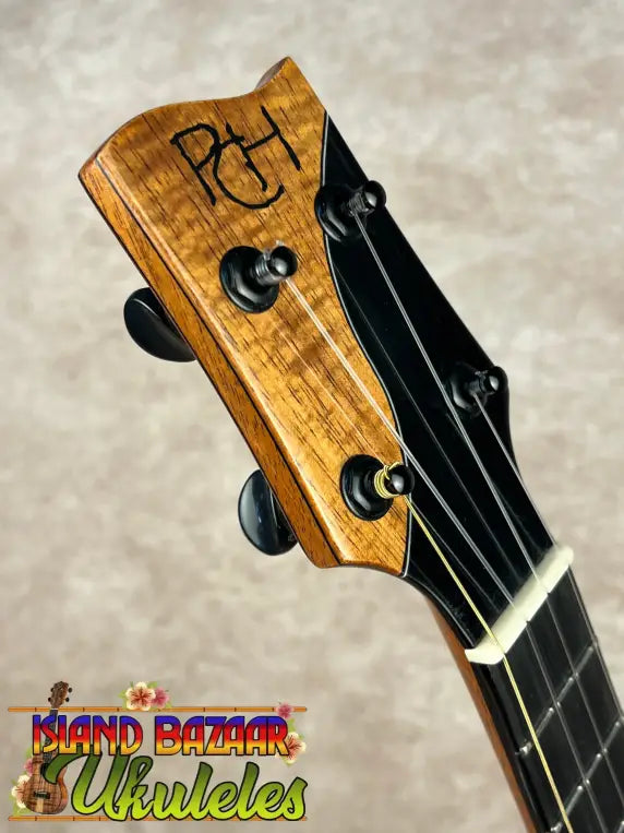 Ukulele headstock with tuning pegs and strings on PCH Sunshine Tenor Ukulele in solid Hawaiian Koa