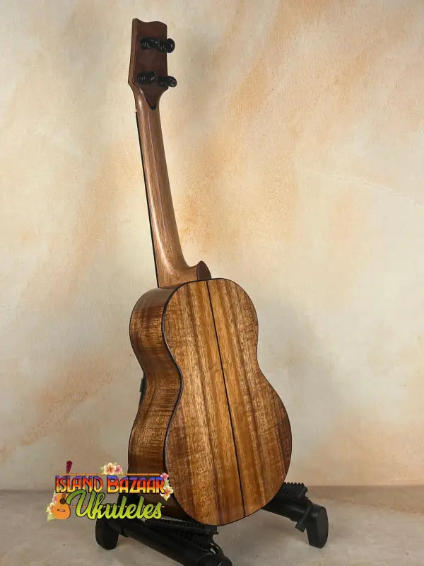 Wooden tenor ukulele on stand from PCH Sunshine Phil Henderson with solid Hawaiian Koa