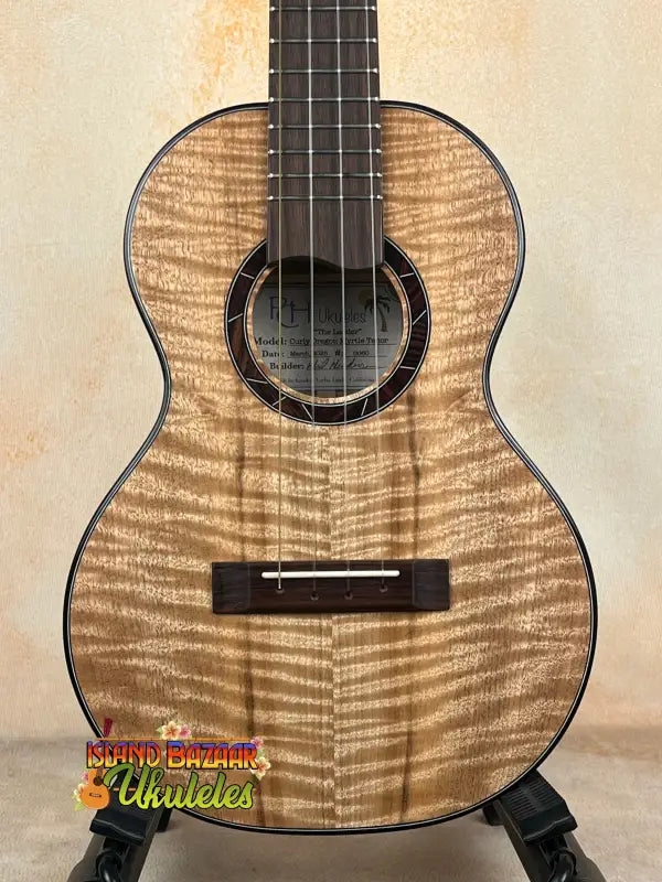 Wooden ukulele with dark fretboard from Phil Henderson’s solid myrtle PCH The Ladder