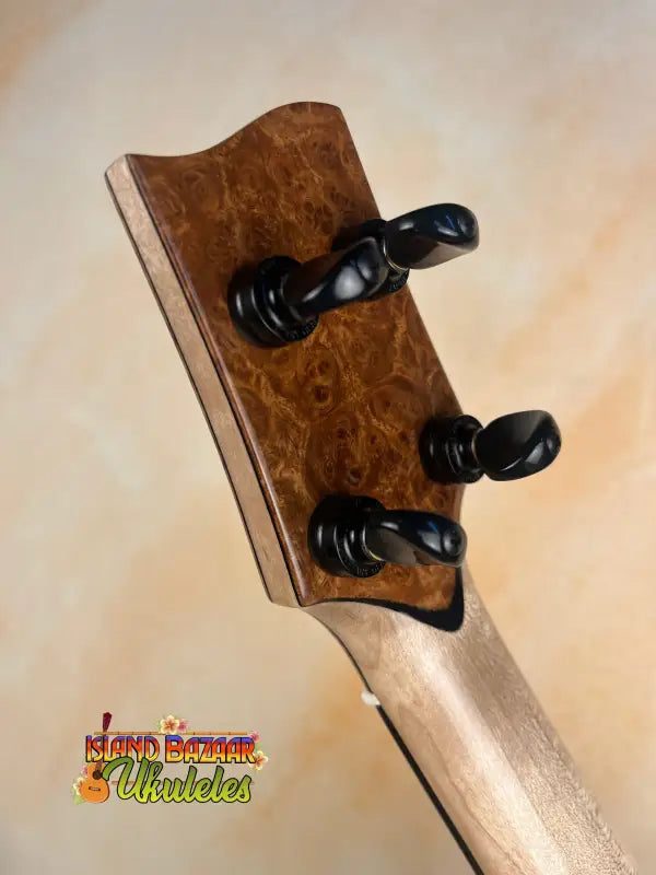 Ukulele headstock with tuning pegs on Phil Henderson solid mango tenor ukulele