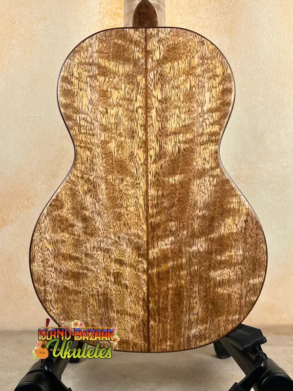 Wooden ukulele back showing solid mango wood for Phil Henderson Custom PCH Tenor Ukulele