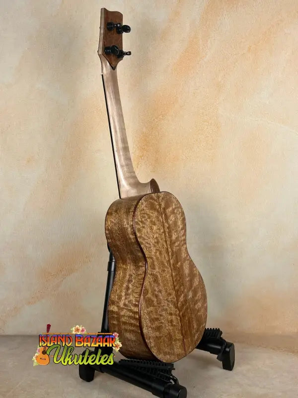 Wooden Phil Henderson Solid Mango Tenor Ukulele on a stand for quality sound