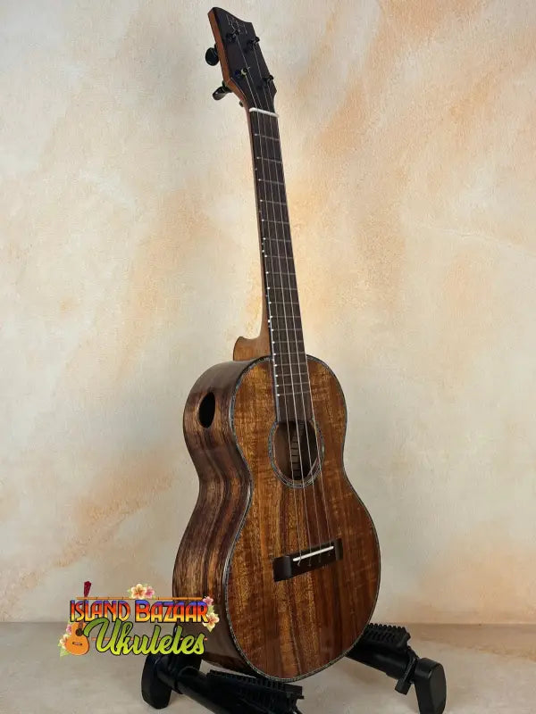 Wooden ukulele with rich brown grain, Phil Henderson Ukuleles Chocolate Thunder Solid Koa Tenor