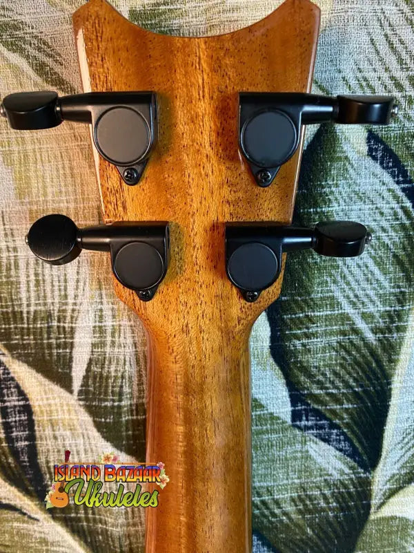 Back view of the tuning pegs on a Romero Creations Concert Ukulele headstock