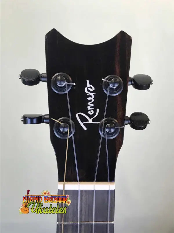 Black ukulele headstock with Pono branding on Romero Creations Grand Tenor Ukulele