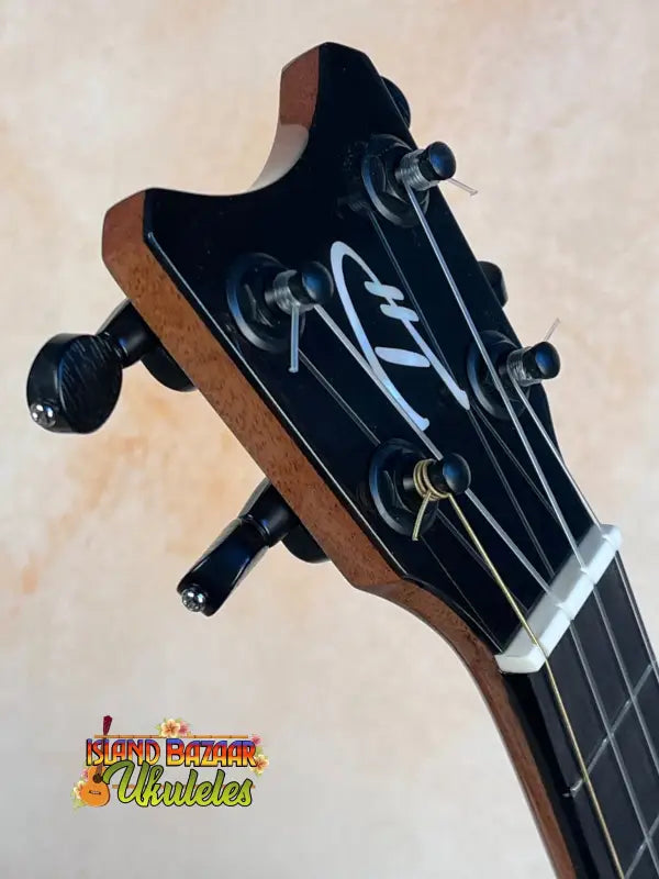 Guitar headstock with black tuning pegs on Romero Creations Tiny Tenor Ukulele in Spalted Mango