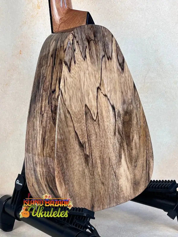 Wooden pear sculpture showcasing grain patterns on Romero Creations Tiny Tenor Ukulele