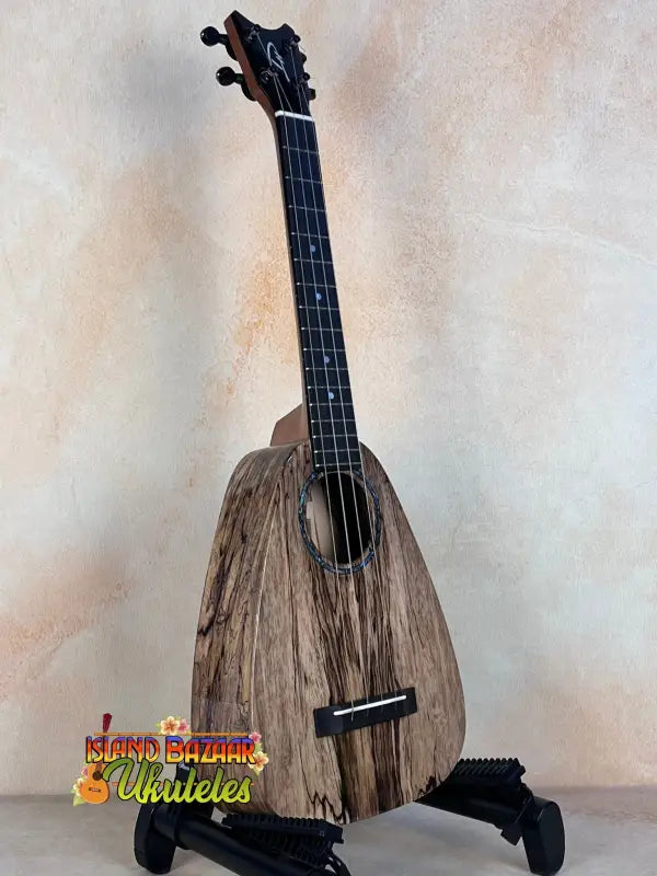 Wooden ukulele featuring a teardrop body and dark fretboard, Romero Creations Tiny Tenor in Spalted Mango