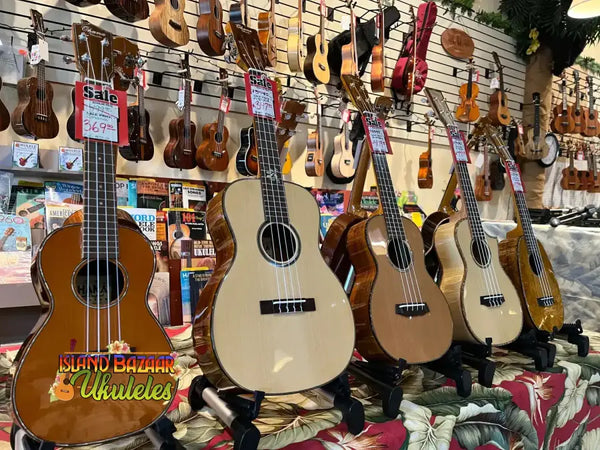 Ukuleles and acoustic guitars on display promoting ShipTection Shipping Protection