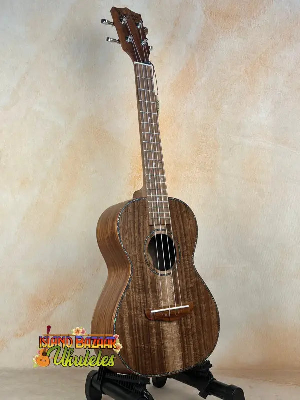 Dark brown Tenor Acacia Ukulele with natural wood grain in Beginners Bundle set