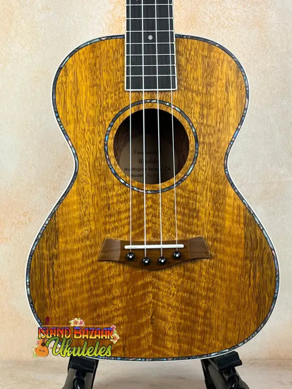 Beautiful Koa wood tenor ukulele in Tenor Mango Ukulele Beginners Bundle from Southern California retail
