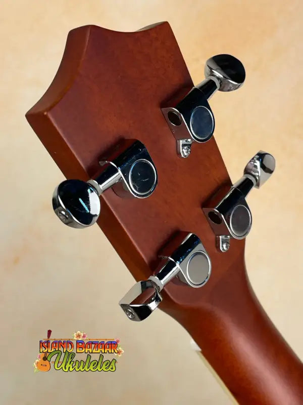 Ukulele headstock with tuning pegs of Tradewinds Resonator Concert Ukulele