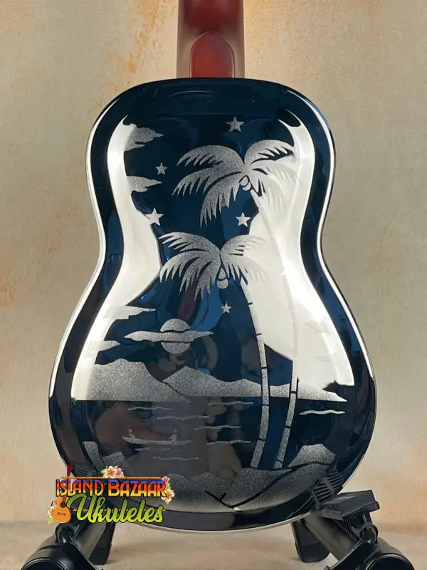 Blue resonator concert ukulele with etched tropical scene from Tradewinds Resonator Concert line