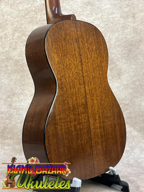 Polished rich brown vintage martin custom baritone ukulele with glossy wood grain finish pre owned with case