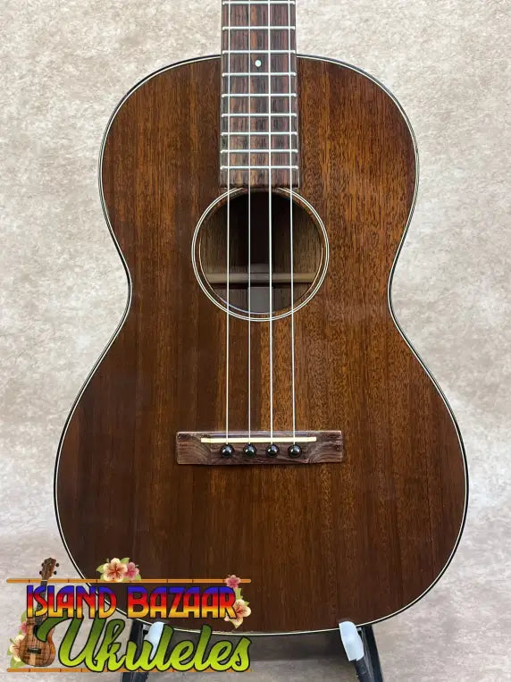 Vintage martin custom baritone ukulele with rich dark brown wood glossy finish and white binding edges pre-owned