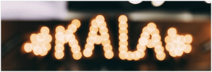 Illuminated KALA letters with decorative shapes showcasing Kala Ukuleles collection.