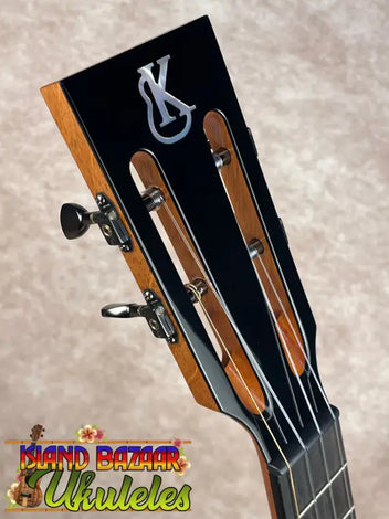 Brown wooden Kanile’a Ukulele handcrafted in Hawai’i for premium Hawaiian music.
