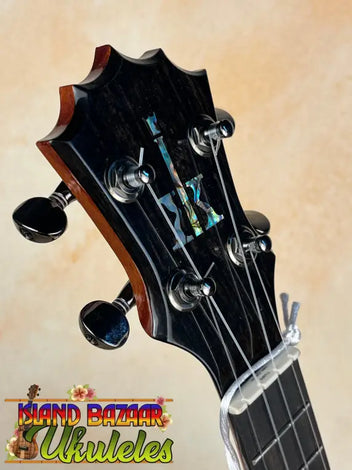 Ukulele strings and neck in dramatic black and white lighting showcasing KoAloha Royal Pikake.