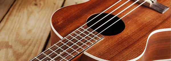 Wooden tenor ukulele with frets and strings from Island Bazaar Uke collection.