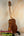 Wooden KoAloha KTM-00 Tenor Ukulele on stand showcasing authentic Hawaiian sound