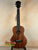 Brown KoAloha KTM-00 Tenor Ukulele with black fretboard for authentic Hawaiian sound
