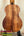 Wooden acoustic guitar with rich koa grain showcased with Kamaka Soprano Ukulele HF-1