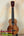 Wooden Kamaka Soprano Ukulele HF-1 with dark finish and black fretboard, solid Koa