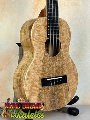 Wooden KoAloha KTM-00 Mango Tenor Ukulele showcasing curly maple grain pattern