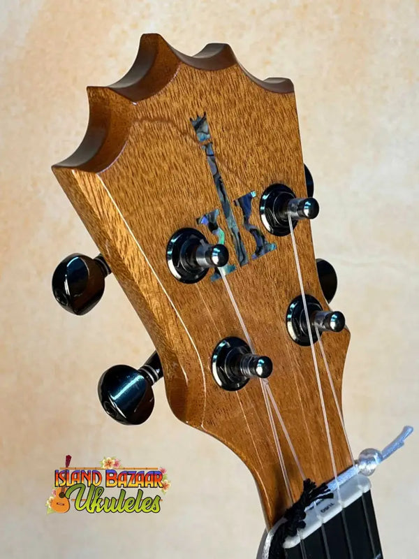 Guitar headstock with black tuning pegs on Beautiful KoAloha KTM-00 Mango Tenor Ukulele