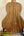 Wooden acoustic guitar back panel on black stand for KoAloha Opio Concert Ukulele