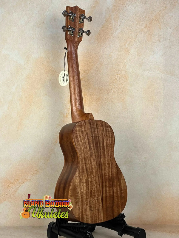 Wooden Concert Acacia Ukulele showcasing wood grain on a stand in a beginners bundle