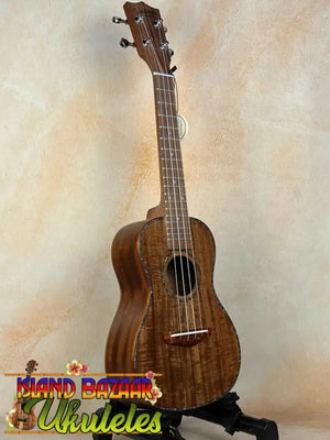 Wooden Concert Acacia Ukulele with rich brown finish in a Beginners Bundle