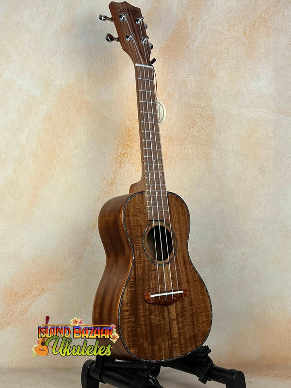 Wooden Concert Acacia Ukulele with rich brown finish in a Beginners Bundle