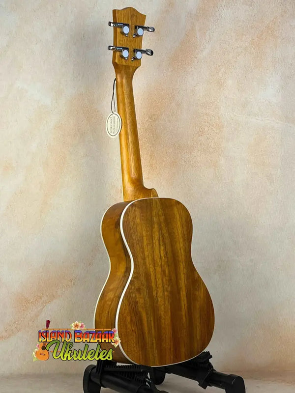 Wooden acoustic guitar with light binding in the Concert Mango Ukulele Beginners Bundle