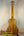 Wooden Concert Mango Ukulele with natural finish and black tuning pegs for beginners