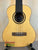 Natural wood Flight Sophia Soundwave tenor ukulele with black tuning pegs and dark fretboard