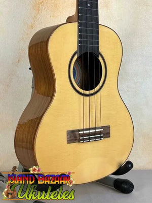 Natural wood Flight Sophia Soundwave Tenor Uke on a black stand with gig bag