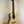 Natural wood Flight Sophia Soundwave Tenor Uke displayed on a black stand