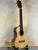 Natural wood Flight Sophia Soundwave Tenor Uke displayed on a black stand