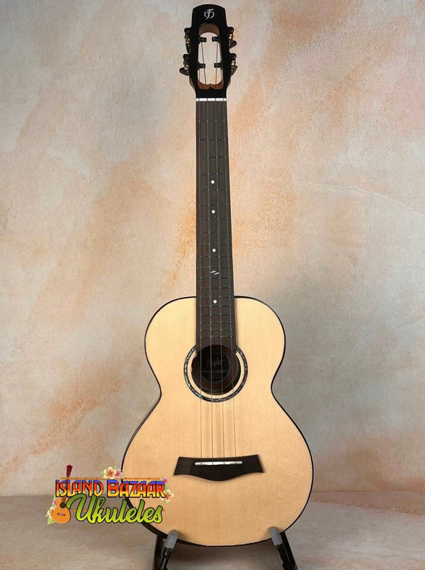 Natural wood acoustic guitar with a light body and dark neck for Flight Voyager Tenor