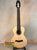 Natural wood acoustic guitar with a light body and dark neck for Flight Voyager Tenor