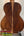 Wooden acoustic guitar back panel showcasing rich grain on Flight Voyager Tenor Ukulele
