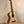 Natural wood Flight Voyager tenor ukulele on black stand with Flight gig bag