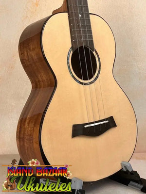 Natural wood baritone ukulele with spruce top, featured in Flight Voyager Tenor Electro-Acoustic