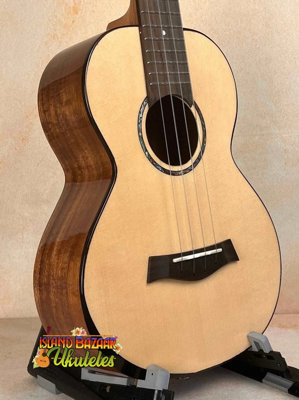 Natural wood baritone ukulele with spruce top, featured in Flight Voyager Tenor Electro-Acoustic